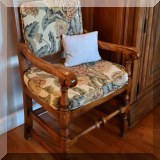 F23. Oak open arm chair with turned legs. 43”h x 24”w x 22”d 